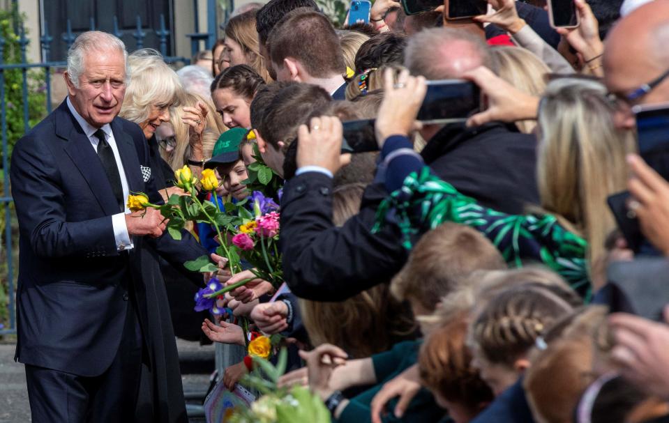 Britain's King Charles III and Britain's Camilla, Queen Consort greet wellwishers (AFP via Getty Images)