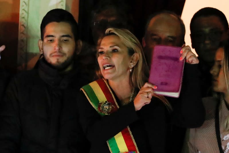 Bolivian Senator Jeanine Anez gestures after she declared herself as Interim President of Bolivia, at the balcony of the Presidential Palace, in La Paz