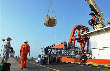 The Singaporean submarine support and rescue vessel, MV Swift Rescue, is prepared before it departs to assist in the search for missing Malaysian Airlines flight MH370 in Singapore, in this March 9, 2014 handout picture. REUTERS/Singapore MINDEF/Handout via Reuters