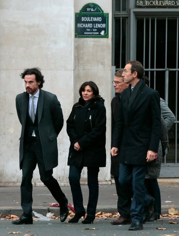 Paris mayor Anne Hidalgo (C) arrives at the scene of the Bataclan concert hall shootings on November 14, 2015, a day after a string of coordinated attacks left more than 120 people dead in the worst such violence in France's history