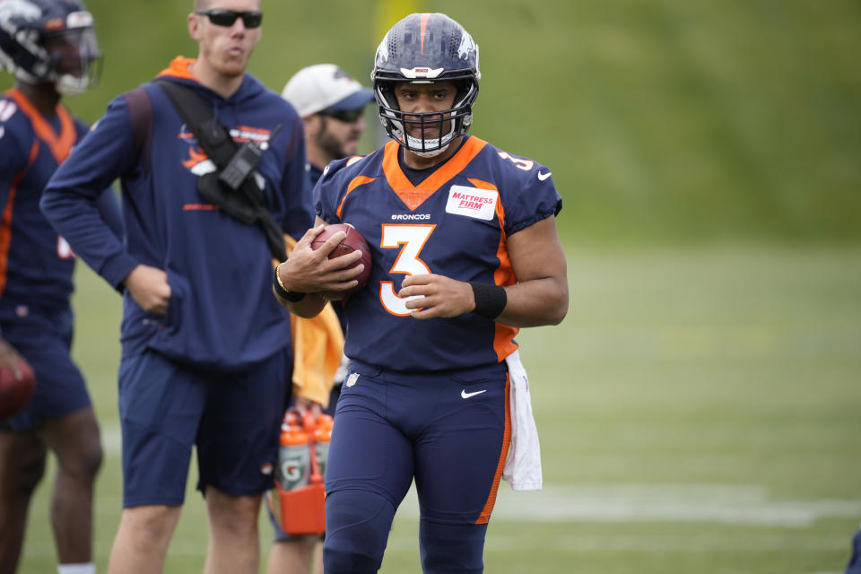 Denver Broncos quarterback Russell Wilson (3) takes part in drills at the NFL football team's headquarters Monday, May 23, 2022, in Centennial, Colo. (AP Photo/David Zalubowski)