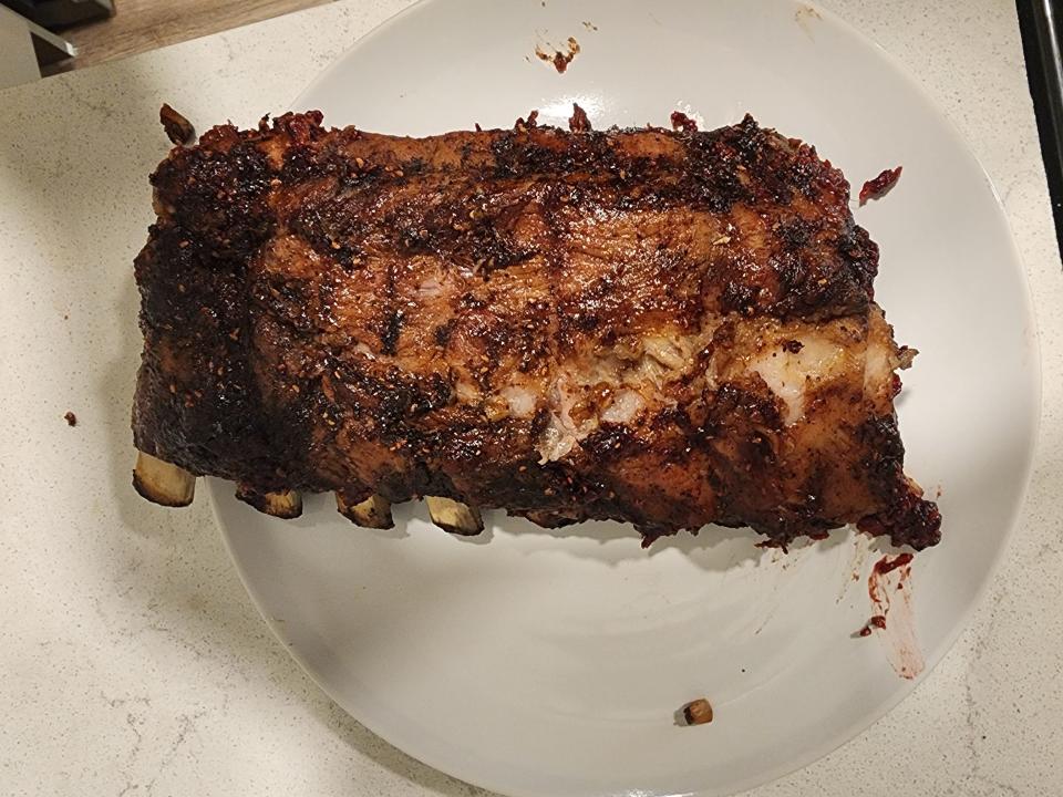 rack of guy fieri's ribs with barbecue sauce on a kitchen counter