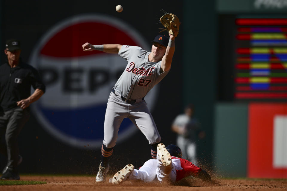 Cleveland Guardians' Andres Gimenez, right, steals second base as Detroit Tigers shortstop Trey Sweeney takes the throw in the third inning during Game 1 of baseball's AL Division Series, Saturday, Oct. 5, 2024, in Cleveland. (AP Photo/David Dermer)