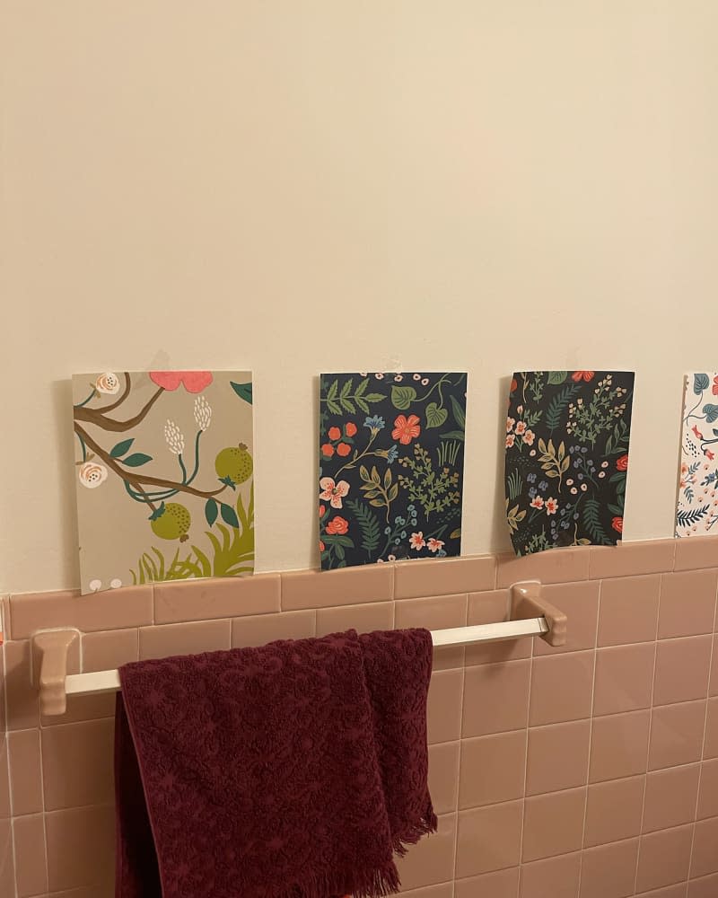 Wallpaper swatches in bathroom during renovation.