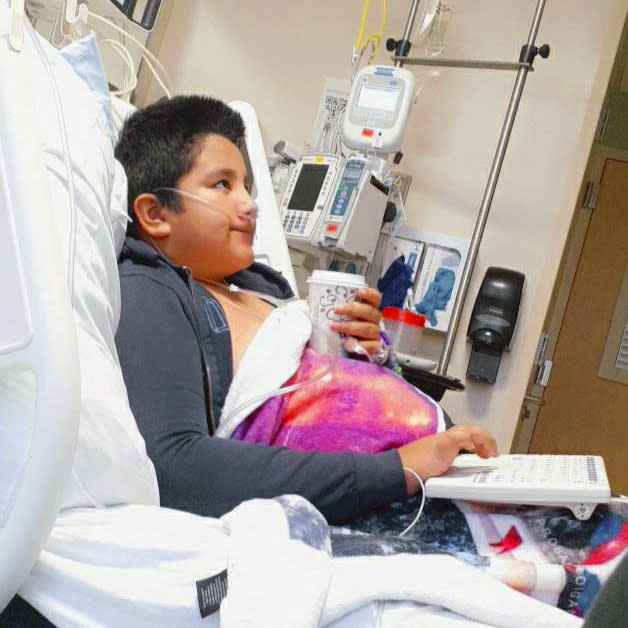 This 2021 photo provided by Yessica Gonzalez shows her son, Francisco Rosales, 9, in the intensive care unit at Children’s Medical Center in Dallas, Texas. The day before he was supposed to start fourth grade, Francisco was admitted to the hospital due to severe COVID-19, struggling to breathe, with dangerously low oxygen levels and an uncertain outcome. (Yessica Gonzalez via AP)