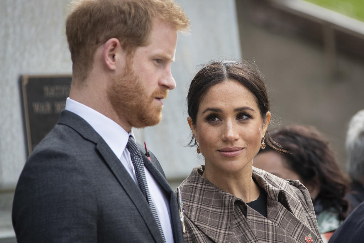 WELLINGTON, NZ - OCTOBER 28: Prince Harry, Duke of Sussex and Meghan, Duchess of Sussex lay ferns and a wreath at the tomb of the Unknown Warrior at the newly unveiled UK war memorial and Pukeahu National War Memorial Park, on October 28, 2018, in Wellington, New Zealand. The Duke and Duchess of Sussex are on their official 16-day Autumn tour visiting cities in Australia, Fiji, Tonga and New Zealand. (Photo by Rosa Woods - Pool/Getty Images)