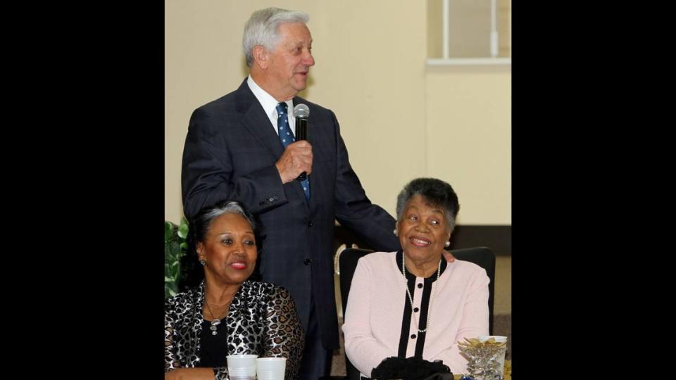 Gulfport Mayor George Schloegel speaks during the Gulfport NAACP Freedom Fund Banquet honoring Lucimarian Roberts (right) and Col. Lawrence Roberts.