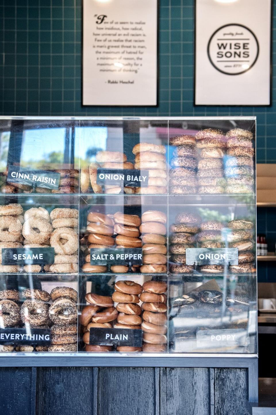 A case of bagels inside a deli