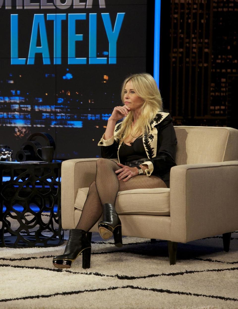 This Oct. 18, 2012 photo released by E! shows host Chelsea Handler during a broadcast of "Chelsea Lately," in Los Angeles. The role of female talk-show hosts in late-night TV network history, all 50-plus years of it, can be summed up in two words: Joan Rivers. It takes just another two _ Arsenio Hall _ to do the same for minorities. There's no indication that's going to change in the latest round of musical chairs involving "Tonight" and "Late Night." (AP Photo/E!, Micah Slay)