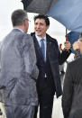 Canadian Prime Minister Justin Trudeau, center, arrives at Kansai International Airport in Izumisano, Osaka prefecture, western Japan, Thursday, June 27, 2019. Group of 20 leaders gather in Osaka on June 28 and 29 for their annual summit.(Kyodo News via AP)