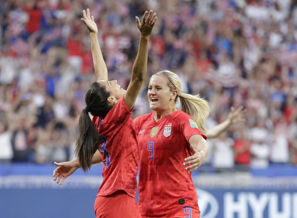 United States' Christen Press, left, celebrates with United States' Lindsey Horan after scoring her side's first goal during the Women's World Cup semifinal soccer match between England and the United States, at the Stade de Lyon, outside Lyon, France, Tuesday, July 2, 2019. (AP Photo/Alessandra Tarantino)