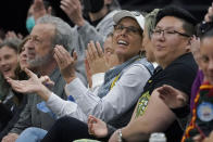 Seattle Storm co-owner Ginny Gilder, center, cheers as she sits courtside on May 18, 2022, at Climate Pledge Arena during a WNBA basketball game between the Seattle storm and the Chicago Sky in Seattle. As Title IX marks its 50th anniversary in 2022, Gilder is one of countless women who benefited from the enactment and execution of the law and translated those opportunities into becoming leaders in their professional careers. (AP Photo/Ted S. Warren)