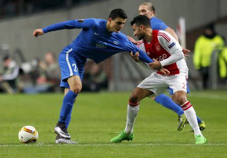 Football Soccer - Ajax Amsterdam v Molde FK - Europa League Group Stage - Group A - Amsterdam-Arena, Amsterdam, The Netherlands - 10/12/15 - Moldeâ€™s Mohamed Elyounoussi (L) in action against Ajax Amsterdamâ€™s Ricardo van Rhijn. REUTERS/Michael Kooren