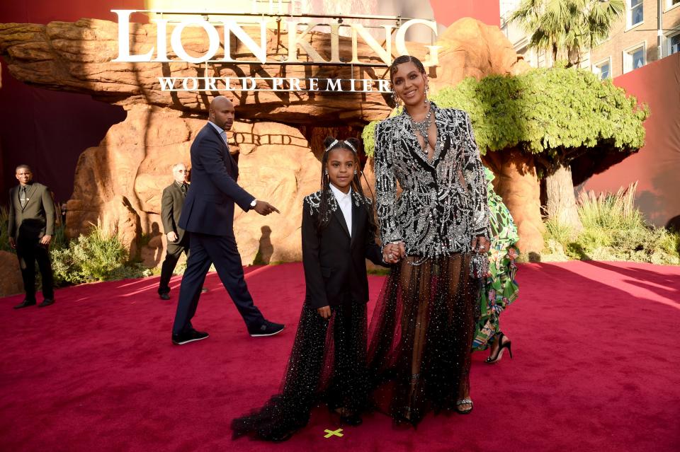 Beyonce, right, and daughter Blue Ivy Carter arrive at the world premiere of "The Lion King" on July 9, 2019, in Los Angeles.