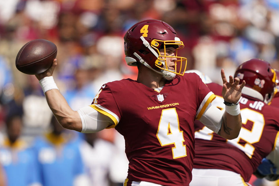 Washington Football Team quarterback Taylor Heinicke (4) throws the ball against the Los Angeles Chargers during the first half of an NFL football game, Sunday, Sept. 12, 2021, in Landover, Md. (AP Photo/Andrew Harnik)