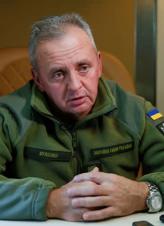 Chief of the General Staff of Ukraine's Armed Forces Viktor Muzhenko speaks during an interview with Reuters on a military plane in Kiev Region, Ukraine September 29, 2018. REUTERS/Valentyn Ogirenko