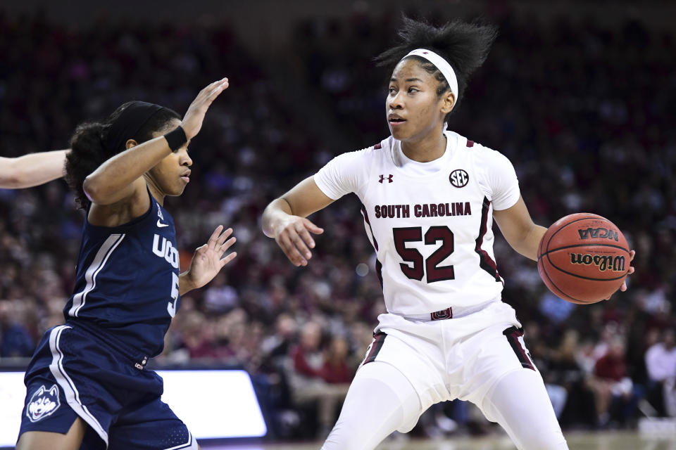 South Carolina guard Tyasha Harris (52) dribbles against Connecticut guard Crystal Dangerfield (5) during the first half of an NCAA college basketball game Monday, Feb. 10, 2020, in Columbia, S.C. (AP Photo/Sean Rayford)