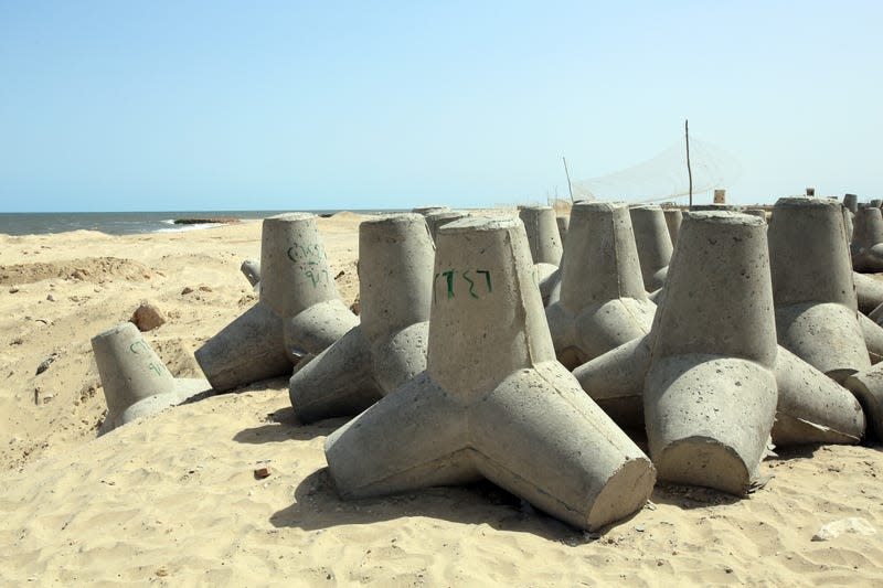 Concrete barriers to defend against sea level rise are shown on the beach outside of Alexandria.