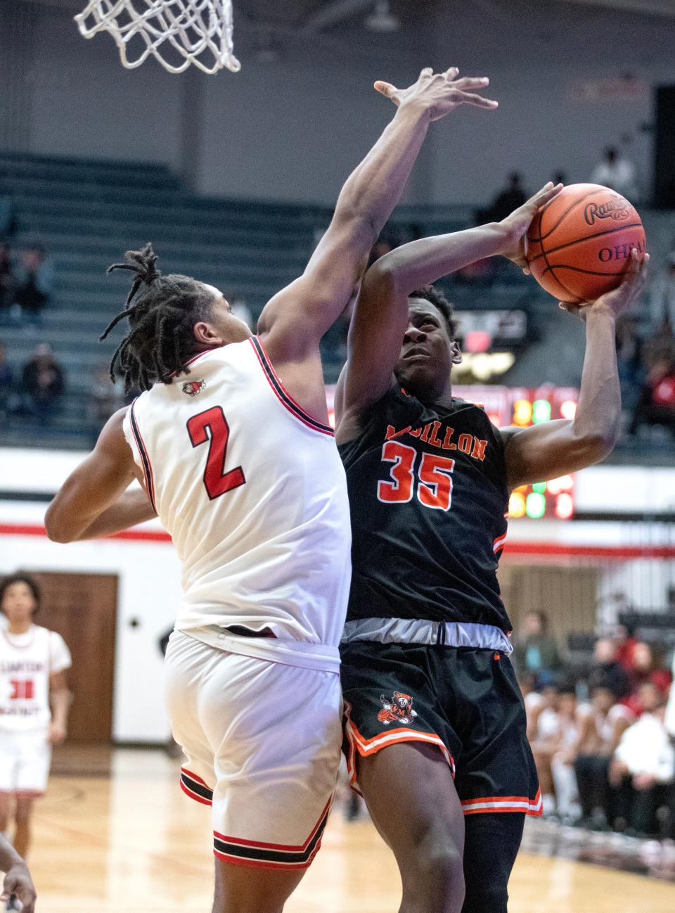 Massillon's Jadyce Thigpen goes to the bucket with pressure from McKinley's Dante McClellan in the second half at McKinley Saturday, Dec. 31, 2022. 