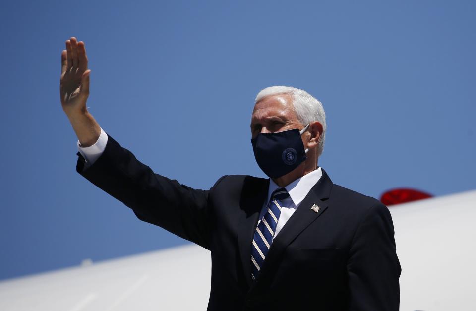 Vice President Mike Pence arrives in Phoenix to meet with Arizona Gov. Doug Ducey on Wednesday. His trip to the state was delayed by a day in part because several Secret Service agents contracted COVID-19. (Photo: ASSOCIATED PRESS)