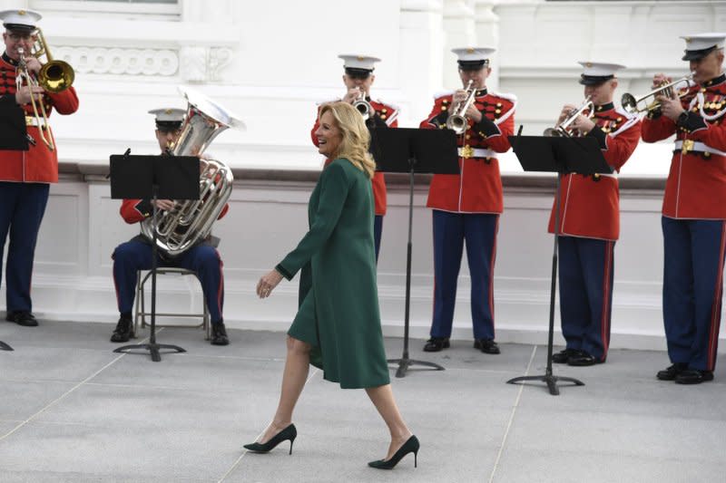 First lady Jill Biden walks past the Marine Band as she departs Monday's ceremony to welcome the arrival of the official 2023 White House Christmas Tree, at the White House in Washington, D.C. The Fraser fir from Fleetwood, North Carolina helps kick off Holiday festivities in the Nation's Capital. Photo by Mike Theiler/UPI