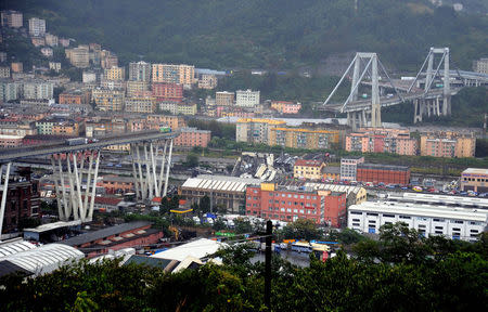 The collapsed Morandi Bridge is seen in the Italian port city of Genoa August 14, 2018. REUTERS/Stringer