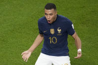 France's Kylian Mbappe celebrates after scoring his side's second goal during the World Cup round of 16 soccer match between France and Poland, at the Al Thumama Stadium in Doha, Qatar, Sunday, Dec. 4, 2022. (AP Photo/Christophe Ena)