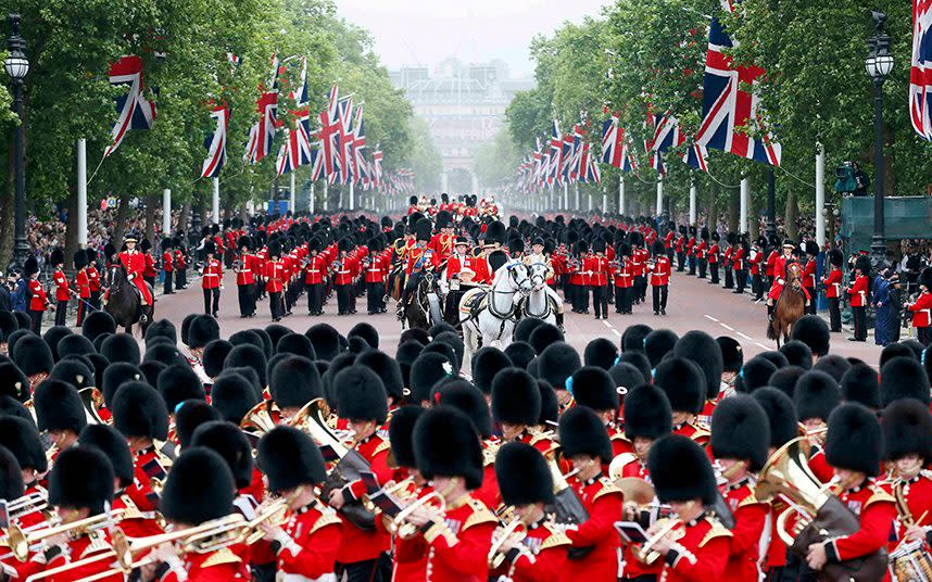 Guardsmen parade down the Mall towards Buckingham Palace after attending the Trooping the Colour ceremony at Horse Guards Parade in central London in 2015 - Credit: Stefan Wermuth /Reuters