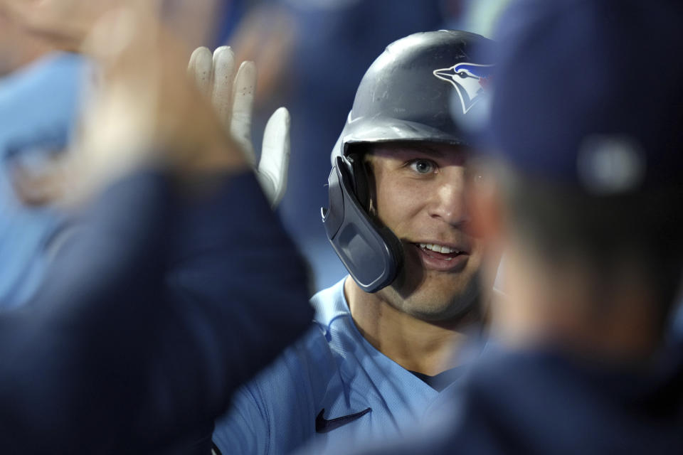 Toronto Blue Jays' Daulton Varsho celebrates with teammates after his home run against the New York Yankees during the third inning of a baseball game Thursday, Sept. 28, 2023, in Toronto. (Chris Young/The Canadian Press via AP)