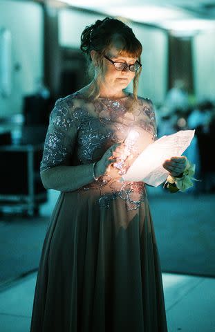 <p>Derrick Parsons</p> Speeches during Alex and Sarah's wedding were read by flashlight