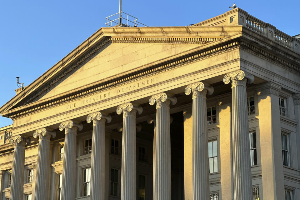 FILE - The Treasury Department is seen near sunset in Washington, Jan. 18, 2023. The national debt is at the core of a dispute about how to raise the government's legal borrowing authority, which could come to a head this summer if the government runs out of accounting maneuvers to keep paying its bills. (AP Photo/Jon Elswick, File)