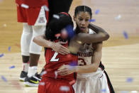 Arizona guard Aari McDonald (2) gets a hug from Stanford guard Anna Wilson (3) at the end of the championship game in the women's Final Four NCAA college basketball tournament, Sunday, April 4, 2021, at the Alamodome in San Antonio. Stanford won 54-53. (AP Photo/Morry Gash)