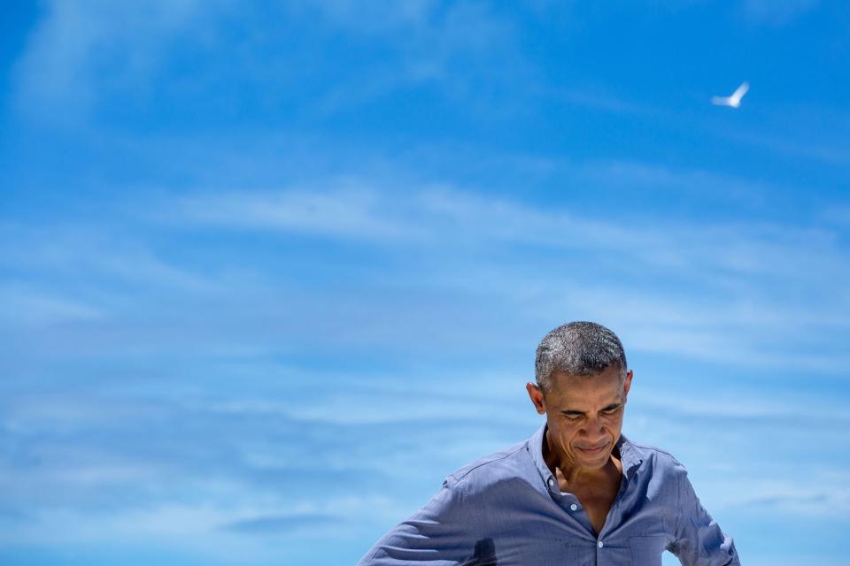 Obama pauses while talking with a writer from National Geographic during his Sept. 1 visit to Midway Atoll&nbsp;in the North Pacific Ocean.