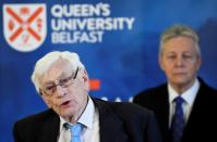 FILE PHOTO: Seamus Mallon speaks as Peter Robinson looks on at an event to celebrate the 20th anniversary of the Good Friday Agreement, in Belfast