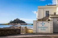 <p>Hole up for the weekend at <a href="https://www.booking.com/hotel/gb/godolphin-arms-marazion.en-gb.html?aid=2070935&label=coastal-retreats" rel="nofollow noopener" target="_blank" data-ylk="slk:Godolphin Arms;elm:context_link;itc:0;sec:content-canvas" class="link ">Godolphin Arms</a> on the West Cornwall coast, which has incredible views out to St Michael's Mount. You can enjoy Cornish crab and cream teas out on the terrace, and wake up to Mount's Bay in a Sea View room. </p><p>A completely magical setting with delicious locally -sourced food, the coastal retreat is just 10 miles from pretty St Ives and seven miles from charming Mousehole.</p><p><a class="link " href="https://www.booking.com/hotel/gb/godolphin-arms-marazion.en-gb.html?aid=2070935&label=coastal-retreats" rel="nofollow noopener" target="_blank" data-ylk="slk:CHECK AVAILABILITY;elm:context_link;itc:0;sec:content-canvas">CHECK AVAILABILITY</a></p>