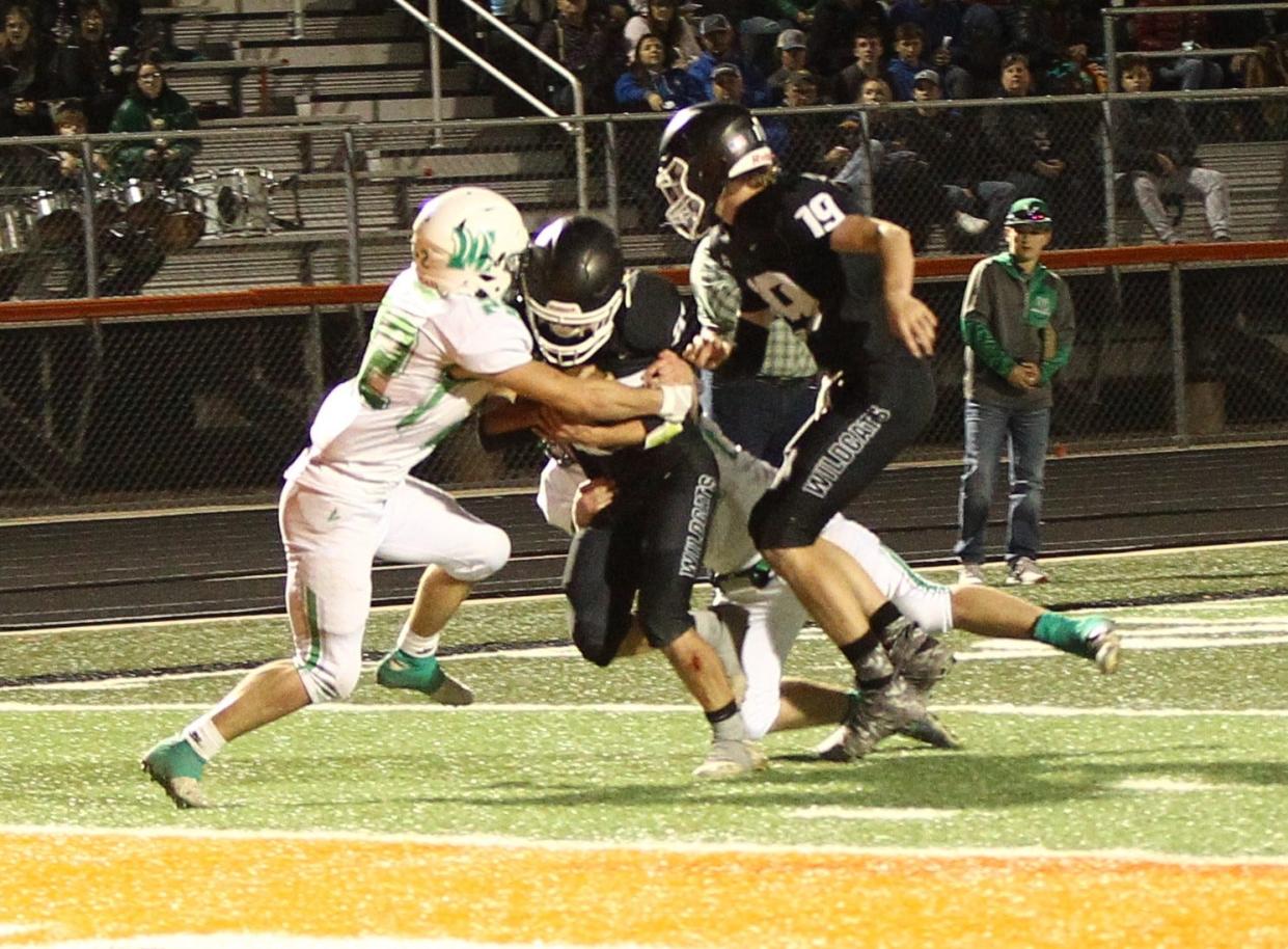 May High School's Kaden Halk (22) tackles Water Valley's Nathan Treadaway short of the goal line during a Class 1A Division I football state quarterfinal game Saturday, Nov. 27, 2021, at Griffith Stadium in Robert Lee.