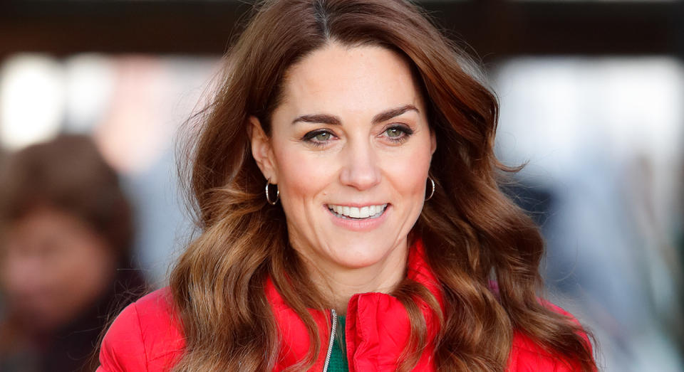 Kate Middleton wearing a bright red jacket.