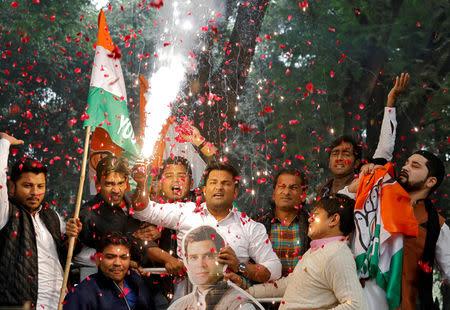 FILE PHOTO: Supporters of India's main opposition Congress party celebrate after initial poll results at the party headquarters in New Delhi, India, December 11, 2018. REUTERS/Anushree Fadnavis/File Photo