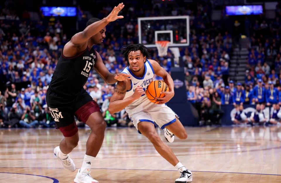 Kentucky’s D.J. Wagner (21) dribbles against Texas A&M’s Henry Coleman III (15) during the SEC Tournament quarterfinals at Bridgestone Arena in Nashville. Silas Walker/swalker@herald-leader.com