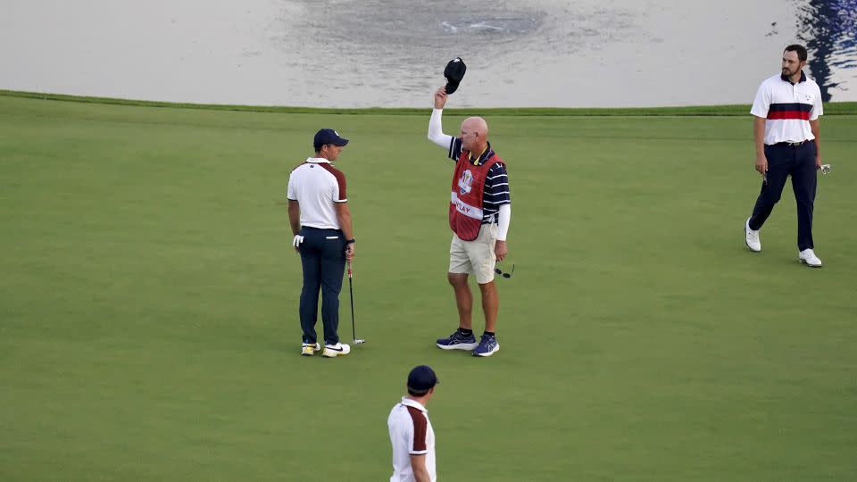 McIlroy confronts LaCava, caddie for Cantlay (right). - Zac Goodwin/PA Images/Getty Images