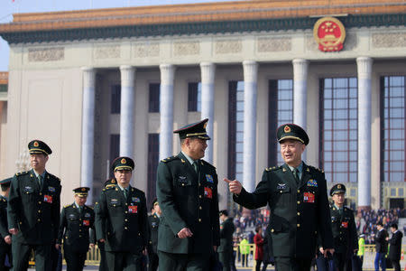 Military delegates leave the Great Hall of the People after a meeting ahead of National People's Congress (NPC), China's annual session of parliament, in Beijing, China March 4, 2019. REUTERS/Aly Song