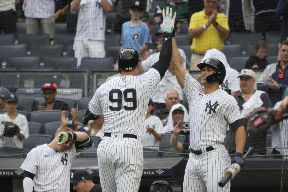New York Yankees' Aaron Judge (99) celebrates with Giancarlo Stanton after hitting a solo home run in the first inning of a baseball game against the Washington Nationals, Thursday, Aug. 24, 2023, in New York. (AP Photo/Mary Altaffer)