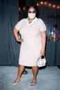 <p>Lizzo steps out in a striped dress and white sandals as she leaves dinner at Crossroads Kitchen in L.A. on Monday night. </p>