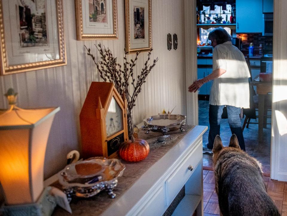 Ursula Perkins grabs a cup of coffee in her home before getting picked up for a doctor's appointment by Heart to Heart, a new organization created by former York Hospital CEO Jud Knox that provides free services to the elderly, Tuesday, Nov. 23, 2021 in York, Maine. As the demand for services continues to rise, Knox said the organization is in need of more volunteers.