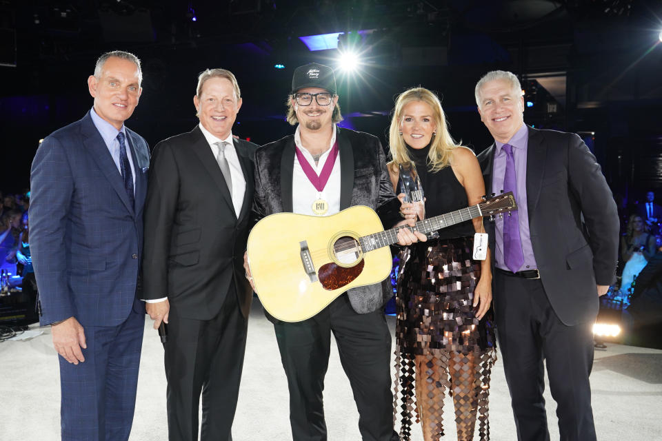 NASHVILLE, TENNESSEE - NOVEMBER 08: (L-R) BMI President and Chief Executive Officer Mike O'Neill, BMI Vice President of Creative Clay Bradley, BMI songwriter of the year Michael Hardy,  BMIs Assistant Vice President, Creative Leslie Roberts and BMI executive VP creative & licensing, Mike Steinberg take photos onstage during the 2022 BMI Country Awards at BMI on November 08, 2022 in Nashville, Tennessee. (Photo by Erika Goldring/Getty Images for BMI)