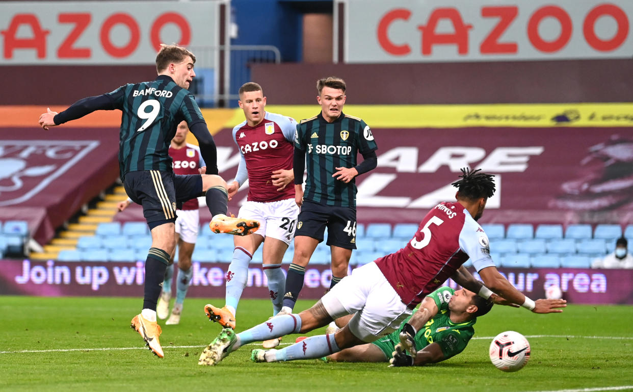 Leeds United's Patrick Bamford (left) scores his side's first goal of the game during the Premier League match at Villa Park, Birmingham. (Photo by Laurence Griffiths/PA Images via Getty Images)