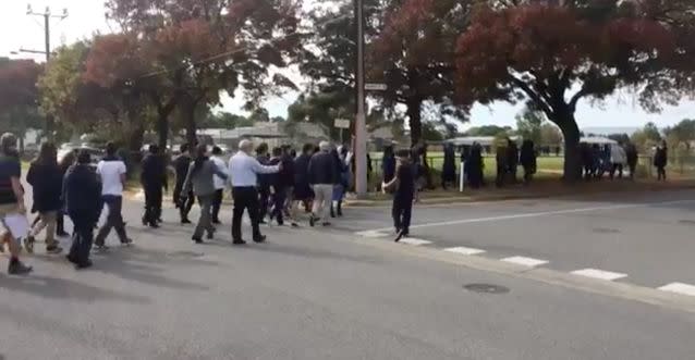 Student make their way back to class after getting the all clear. Source: 7 News/Mark Mooney