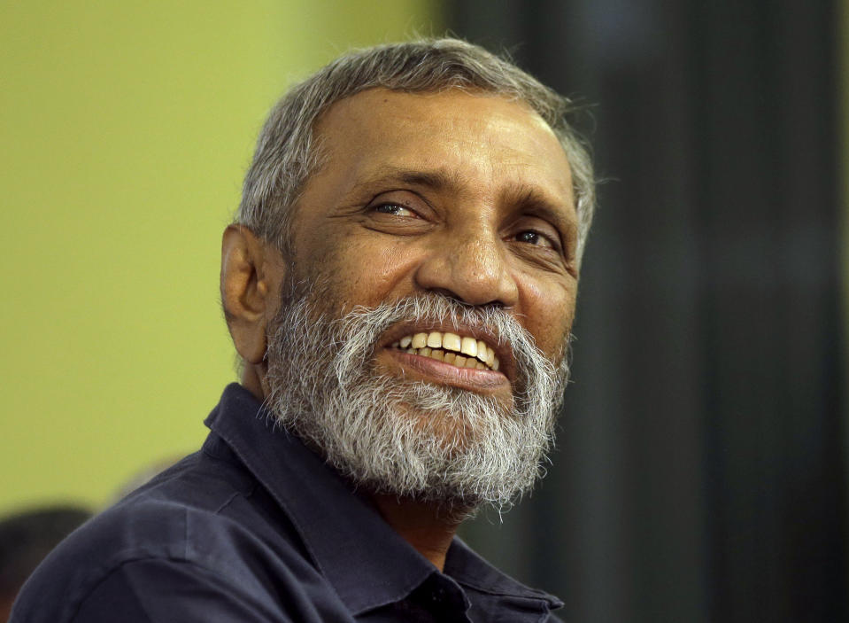 Sri Lanka's elections chief Mahinda Deshapriya gestures during a press conference in Colombo, Sri Lanka, Wednesday, Oct. 16, 2019. Deshapriya says he has asked for an explanation from the defense ministry on why the army commander features in an advertisement promoting a candidate for next month's presidential election. The advertisement, which appeared in a newspaper last weekend, had comments made by Lt. Gen. Shavendra Silva, the current army chief, in 2009 praising presidential candidate Gotabaya Rajapaksa for his role in ending the country's long civil war. (AP Photo/Eranga Jayawardena)