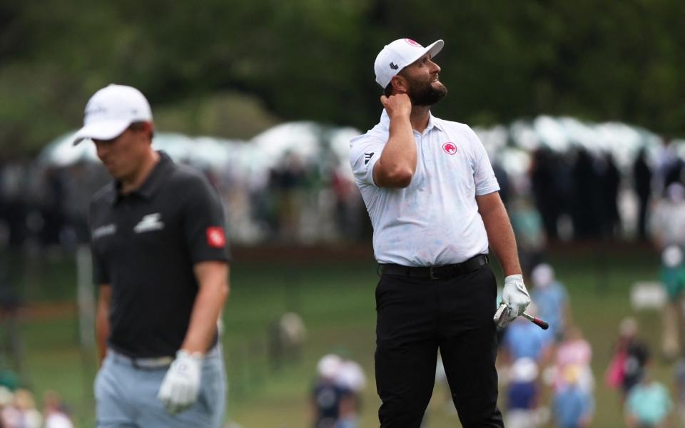 Spain's Jon Rahm looks up on the 1st hole during the first round