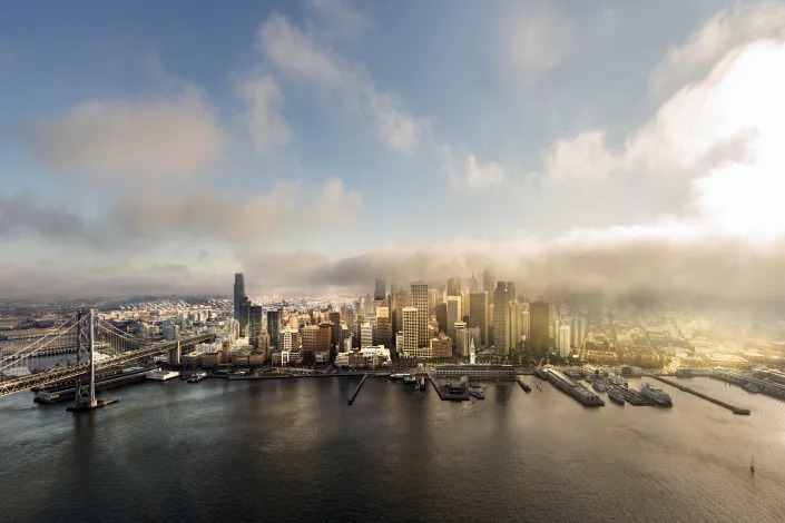 An aerial view of the port of San Francisco shrouded in fog.